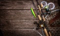 Fishing tackle composition, wood background. Royalty Free Stock Photo