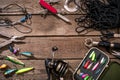 Fishing tackle - fishing spinning, fishing line, hooks and lures on wooden background.