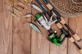 Fishing tackle - fishing spinning, hooks and lures on wooden background with copy space Royalty Free Stock Photo