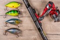 Fishing tackle - fishing spinning, hooks and lures on wooden background Royalty Free Stock Photo