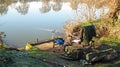 Fishing tackle on the side of a river.