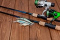 Fishing tackle - fishing spinning, hooks and lures on wooden background with copy space Royalty Free Stock Photo