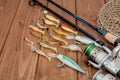 Fishing tackle - fishing spinning, hooks and lures on wooden background with copy space Royalty Free Stock Photo