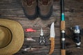 Fishing tackles and fishing gear on wooden background Royalty Free Stock Photo