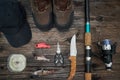 Fishing tackles and fishing gear on wooden background Royalty Free Stock Photo