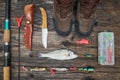 Fishing tackles and fishing gear on wooden background Royalty Free Stock Photo