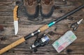 Fishing tackles and fishing gear on wooden background Royalty Free Stock Photo