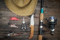 Fishing tackles and fishing gear on wooden background Royalty Free Stock Photo