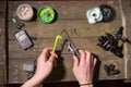 Fishing tools in hands. Fisherman getting ready for fishing. Loop weaving tool. Royalty Free Stock Photo