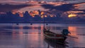 Fishing and touristic boats at sunset