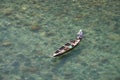 Fishing in transparent water of Dawki River in Meghalaya, India. River has crystal clear water Royalty Free Stock Photo