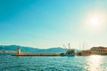 Fishing trawler and a boat in the beautiful harbor of a small town Postira - Croatia, island Royalty Free Stock Photo