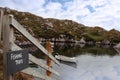 Fishing trips sign and scenic bay view