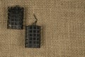 Fishing troughs and fish bait on burlap background. Set of fish feeders. Carp fishing lure Royalty Free Stock Photo