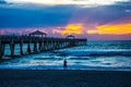 Fishing On and Under the Pier at Dawn Royalty Free Stock Photo