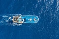 Fishing vessel boat floating in the blue sea, aerial view from above Royalty Free Stock Photo