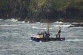 Fishing vessel in choppy seas Royalty Free Stock Photo