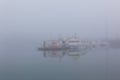 Fishing vessel in a misty morning at Harbor in Hofn, Iceland Royalty Free Stock Photo