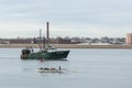 Fishing vessel passing whaleboat