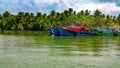 Fishing vessels anchored on the banks of backwaters in Alleppey, Kerala, India Royalty Free Stock Photo