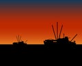 Fishing vessels boats at sunset