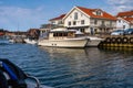 A fishing village on the Swedish West coast. The traditional red sea huts and fishing boats are replaced with big fancy