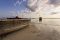 Fishing wooden boat moored on the beach at sunset Royalty Free Stock Photo