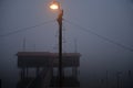 Fishing wooden hut in winter fog by night. Valli di Comacchio, Italy. Royalty Free Stock Photo