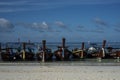 Fishing wooden rowing boats are parked on the beach on Koh Lipe, Thailand.