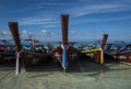 Fishing wooden rowing boats are parked on the beach on Koh Lipe, Thailand.