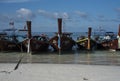 Fishing wooden rowing boats are parked on the beach on Koh Lipe, Thailand.