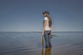 Fishing. Young fisherwoman with tackles and walleye zander fish at lake coast Royalty Free Stock Photo
