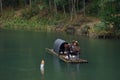 Fishman catching fish in canoe Royalty Free Stock Photo