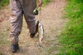 A fishman going away by pathway with fresh fish