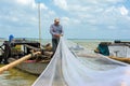 Fishman repairing fishing nets Royalty Free Stock Photo