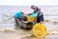 Fishmen pickup fish from boat Royalty Free Stock Photo