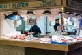 fishmonger and market stall with fresh seafood in the Alicante market hall