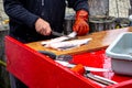 Fishmonger preps fish