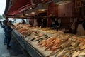 fishmonger selling fresh fish to clients at the market in downtown Syracuse