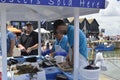 Fishmongers prepare and shuck oysters at the Whitstable Oyster Festival Royalty Free Stock Photo