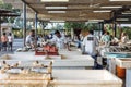 Fishmongers and seafood sellers in semi-outdoor, open air seafood market near Palm Deira metro station in Dubai