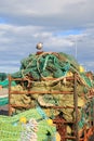 Fishnet bales, rolled up, ready to fish with seagull