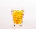 Fishoil in measuring cup Royalty Free Stock Photo