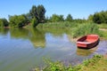 Fishpond with red boat Royalty Free Stock Photo
