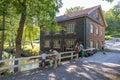 People next to the Mill in Fiskars village, a historical ironworks area and popular travel