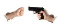 Fist against hand with gun, danger and violence concept Royalty Free Stock Photo