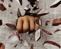 Fist breaking a wall Royalty Free Stock Photo