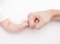 Fist of Dad and Newborn Baby. Fist to fist Royalty Free Stock Photo