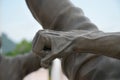 Fist and hand of Kung Fu fighter sculpture, Chinese martial arts,close-up fist and hand on blur and sunset background ,Men fists Royalty Free Stock Photo