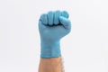 Fist Hand in medical blue latex protective glove on white background Royalty Free Stock Photo